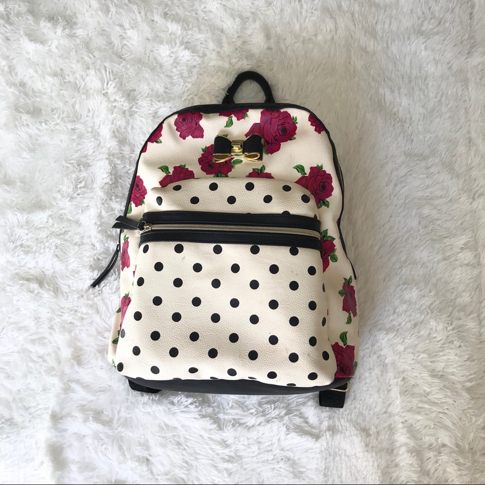 Betsey Johnson floral/dotted/stripped backpack.